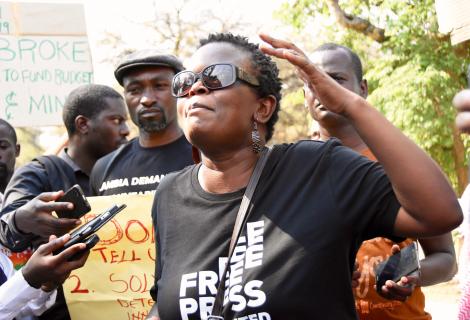 A protester in Zambia calling out corruption