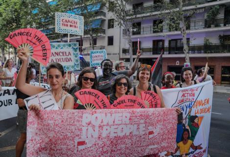 Thousands of activists take to the streets demanding urgent debt cancellation ahead of global summit